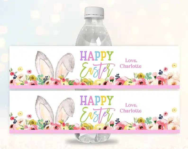 Customizable water bottle label that says Happy Easter love charlotte on them with flowers and bunny ears. 
