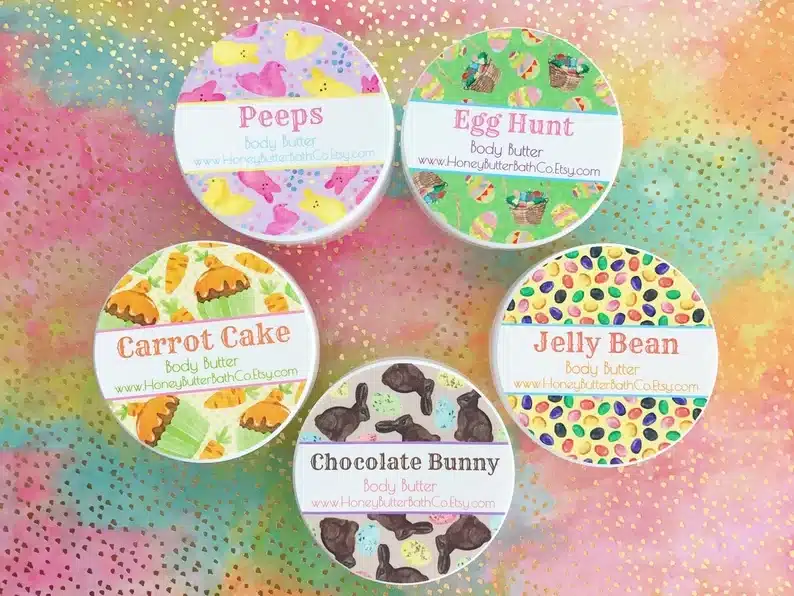 Five round lotions all with different labels on the top, peep, egg hunt, jelly bean, chocolate bunny, and carrot cake scents. 
