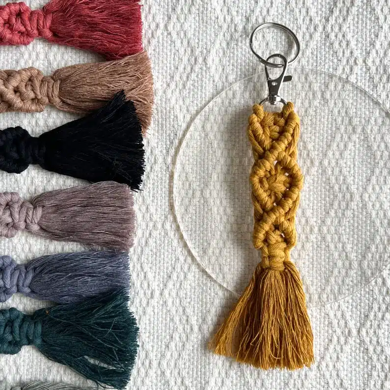 Administrative Assistant Day Gifts Under $10: Brown macramé keychain shown with other colors shown beside it. 
