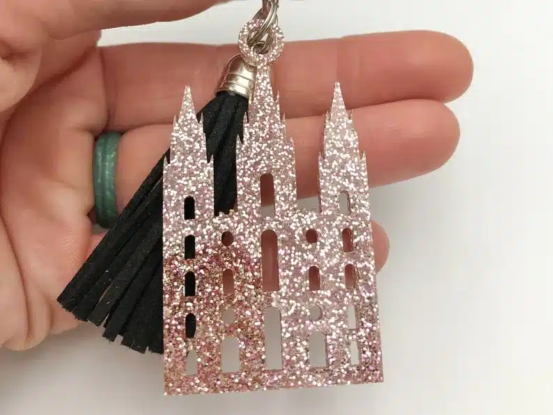 Rose colored sparkly temple keychain. 
