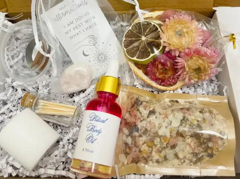 Positive energy bath & body gift set with dried flowers, bubble bath, bath salts, and various other items. 