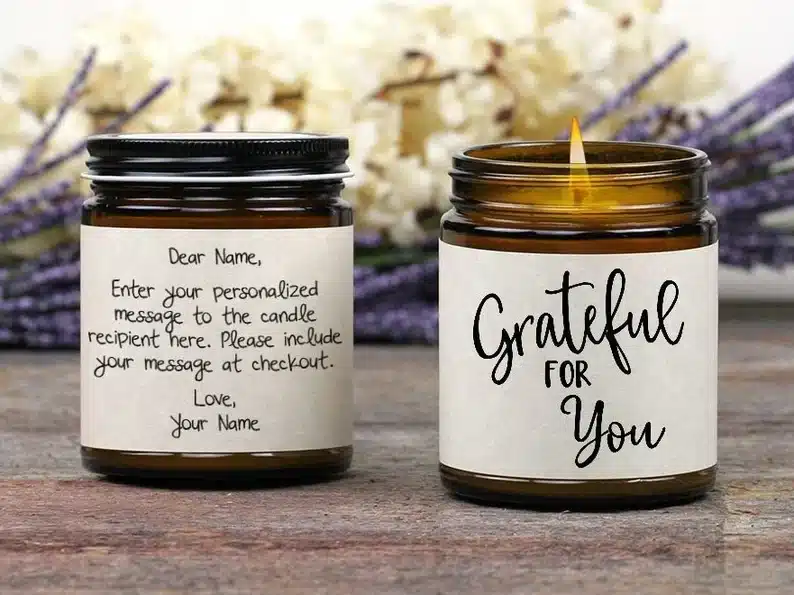 Thank You Gift Ideas for Baby Shower Hosts: two glass jar candles with white labels on it. 