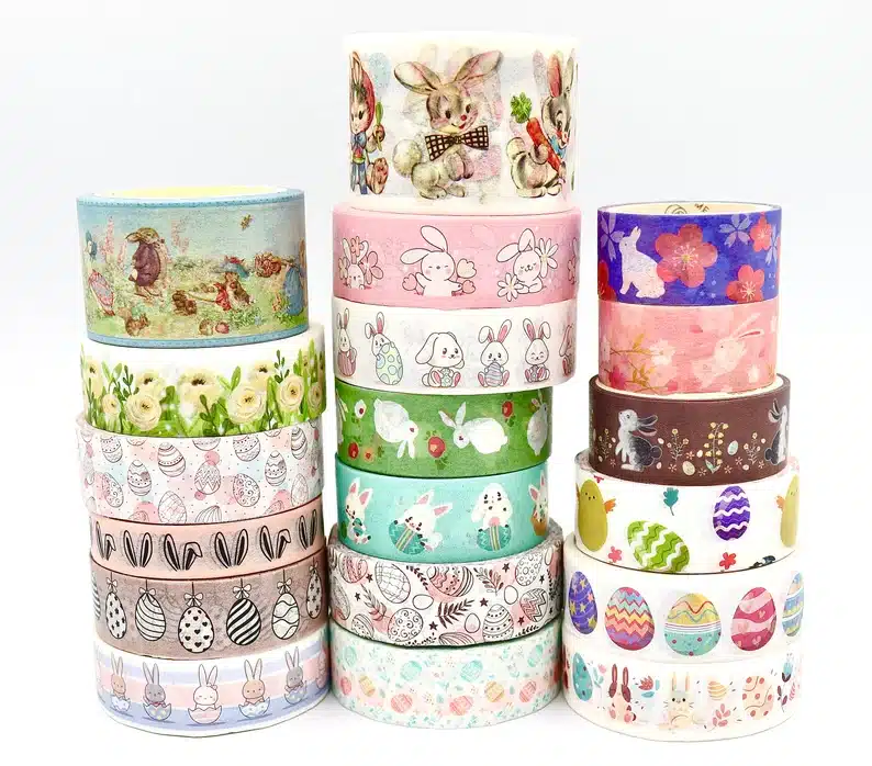 Many rolls all stacked on top of each other of fun Easter themed tape. 