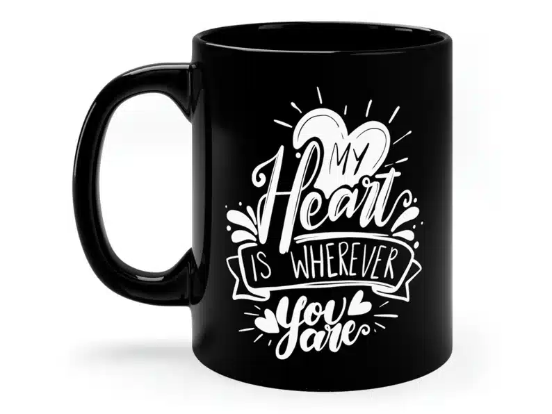 Mother’s Day Gifts for a Daughter: Black coffee mug with white font that says My heart is wherever you are. 
