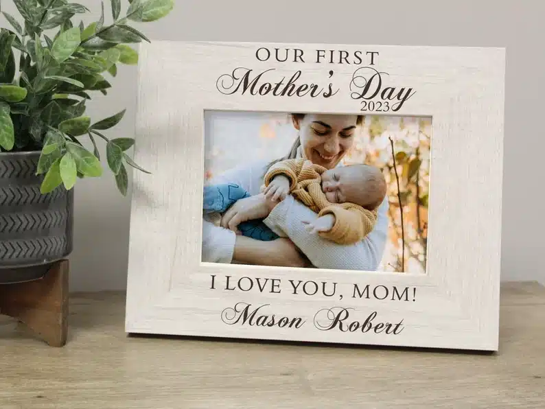 Personalized frame that reads our first mothers day 2023 on the top and below photo I love you mom! and signed by mason Robert. 