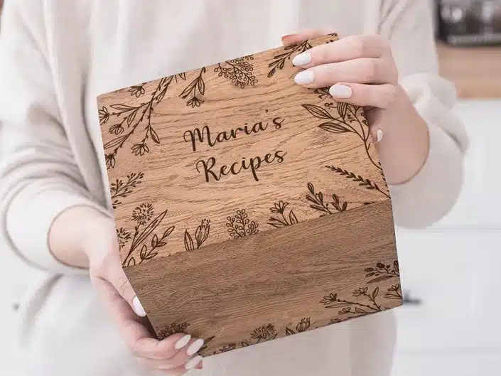 Wooden engraved box that says maria's recipes. 