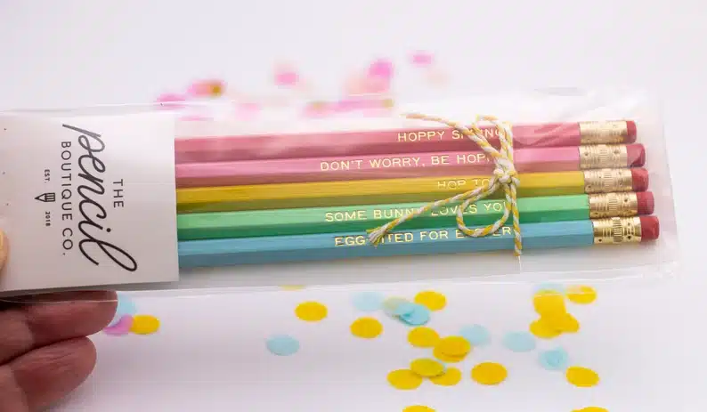 Wrapped up colorful pencils, rose pink, light pink, yellow, mint green, and light blue. 