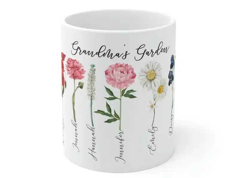 White coffee mug that is customizable to have names and flowers. 