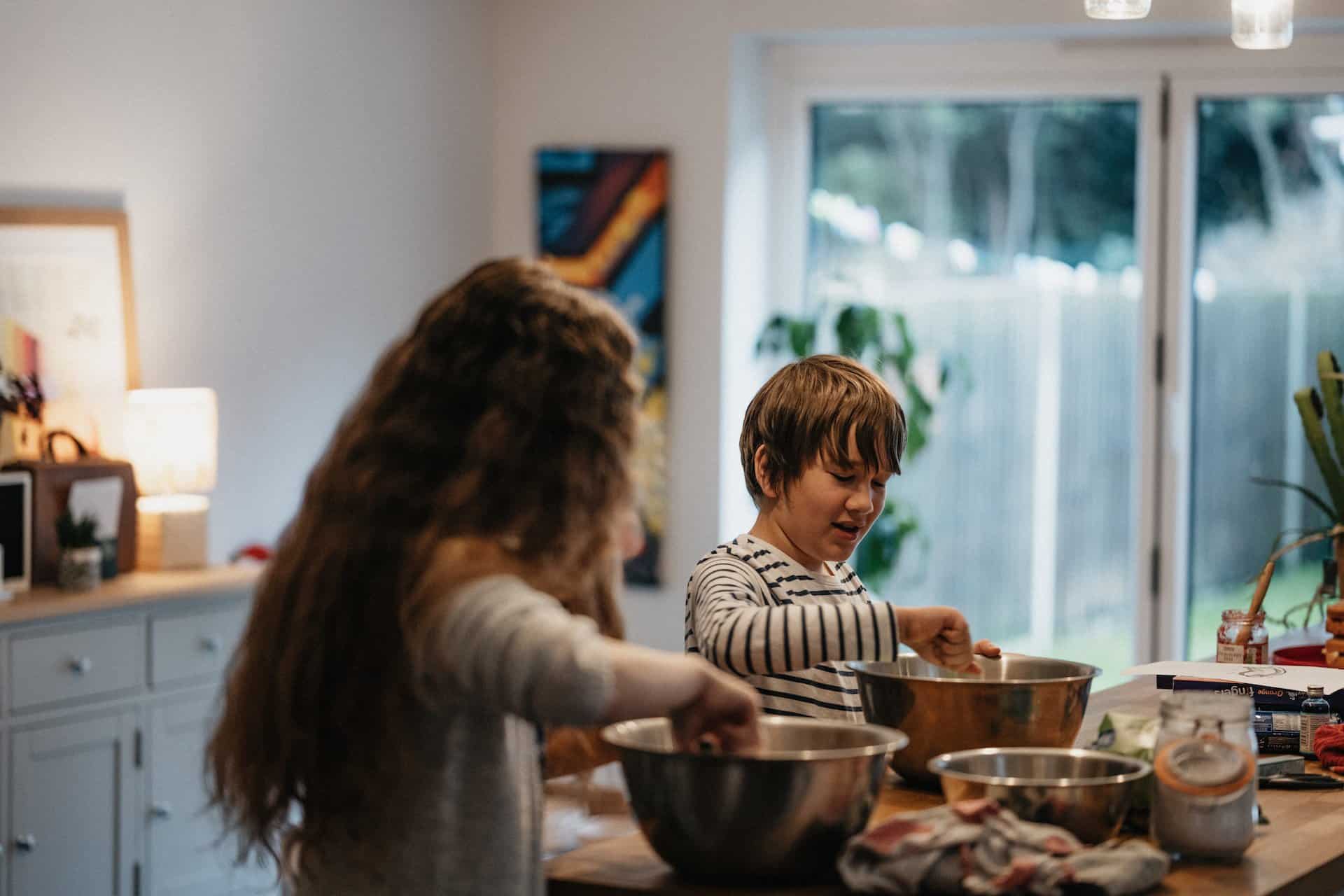 Kids cooking a meal for mom as a Mother's day gift