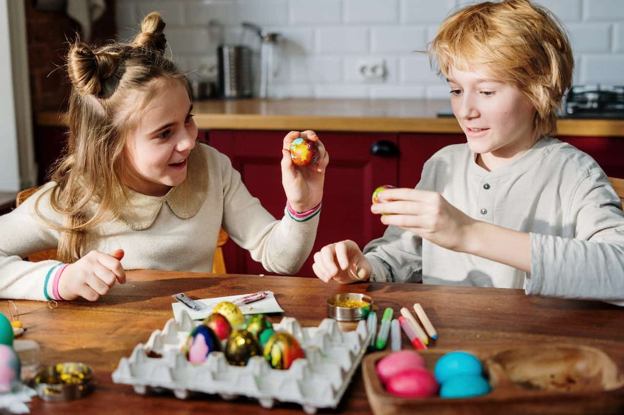 Keeping kids busy painting eggs at an easter party