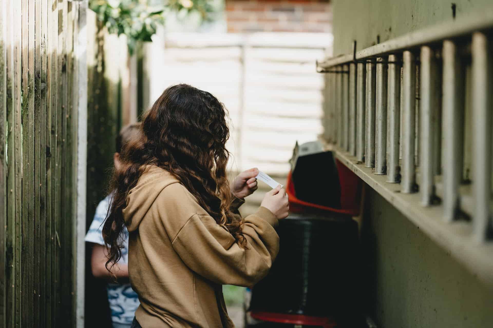 Kids doing an outdoor scavenger hunt