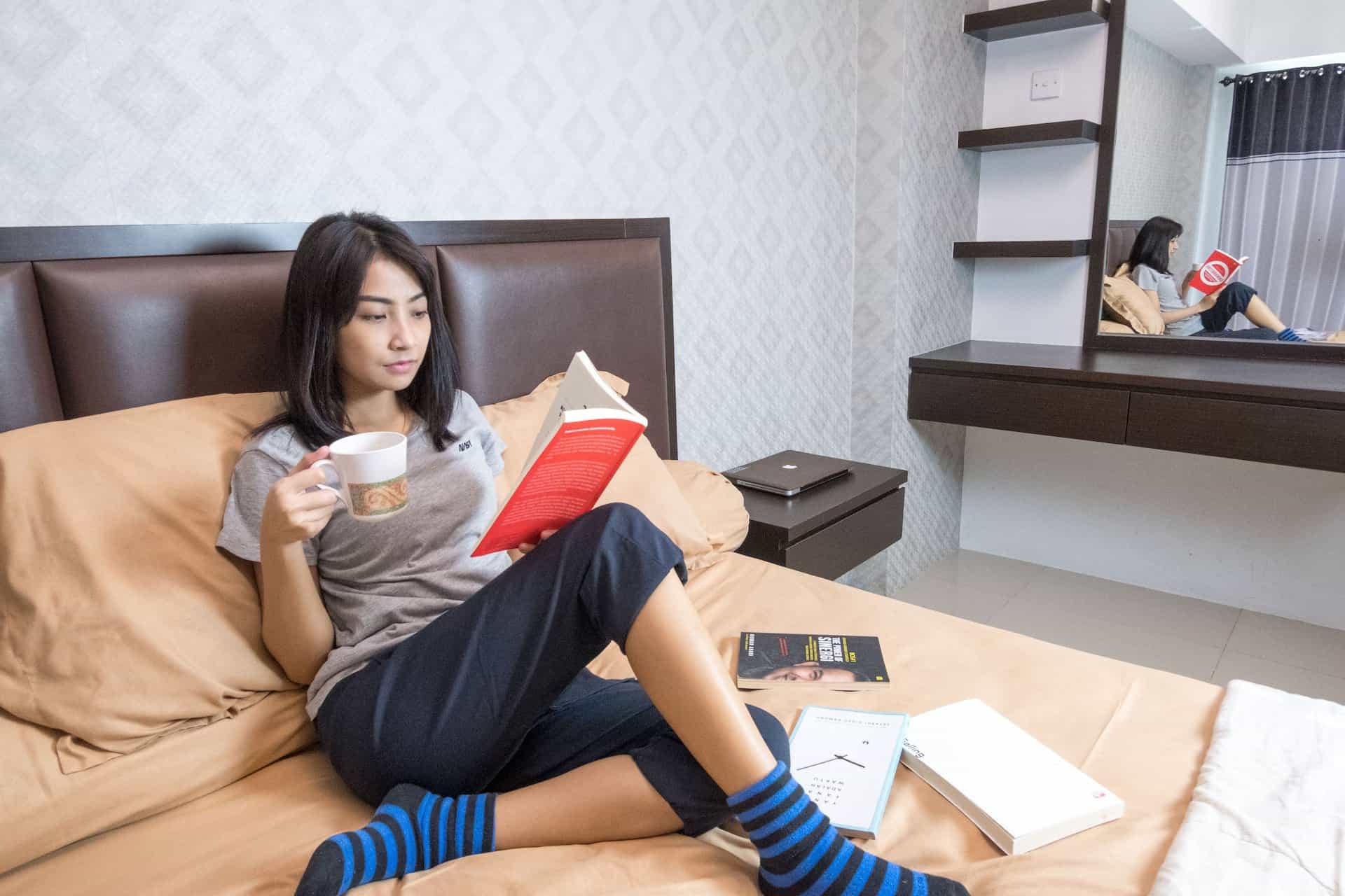 Woman reading a book taking a break