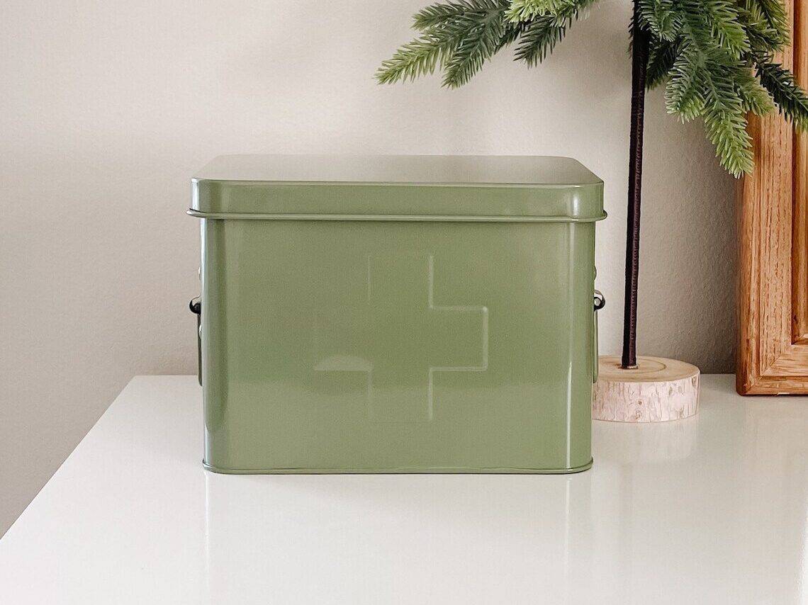 Metal first aid kit in olive green