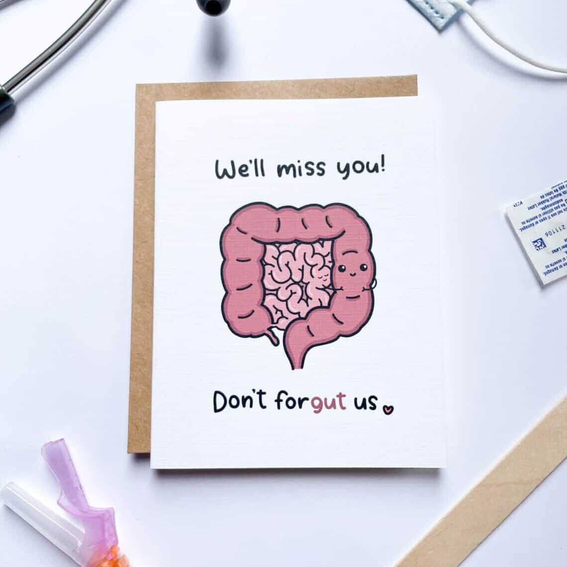 White card with a cartoon of intestines that says in black font 