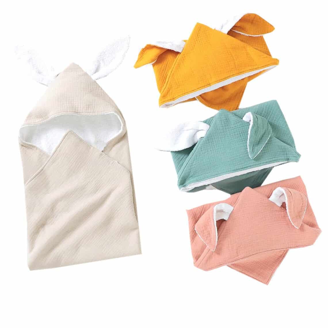 Four rabbit hooded towels shown, one light grey, orange, blue, and pink.
