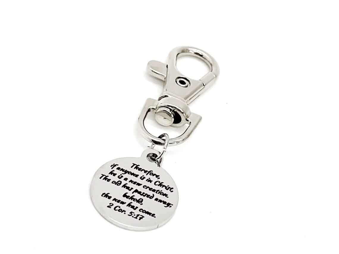 Silver zipper charm that has a saying about new beginnings.