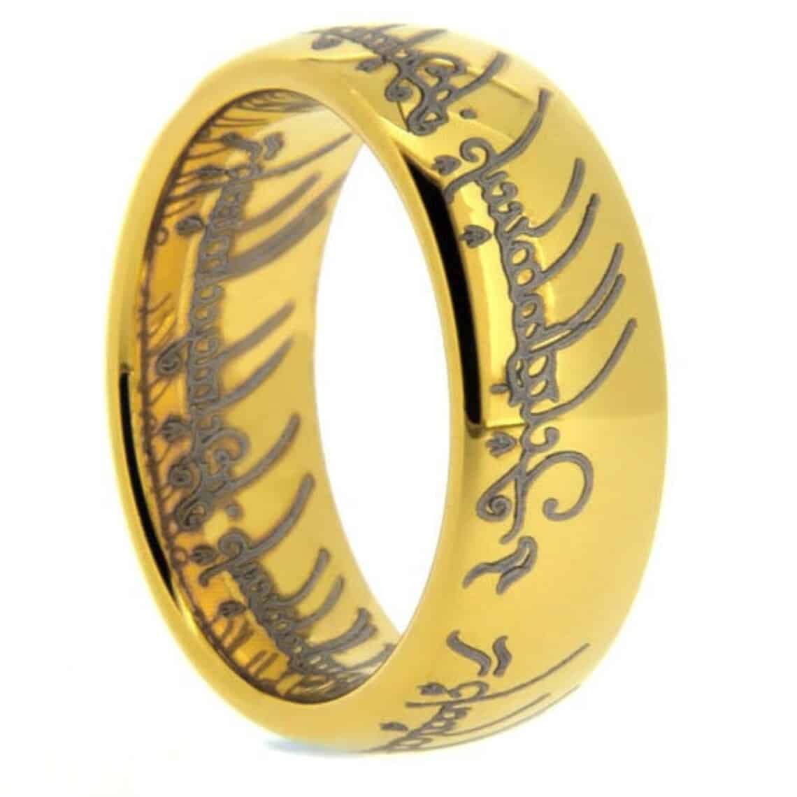 Golden ring with writing on it.