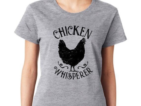 Light grey t-shirt with black chicken on it with the font 
