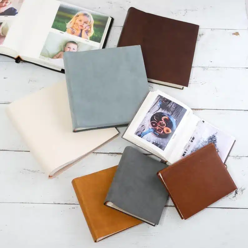 Leather photo albums, grey, brown, light brown, and white. 