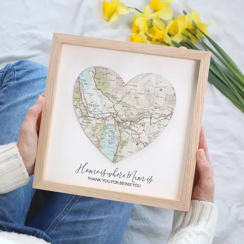 Light wood framed photo of a heart map. 