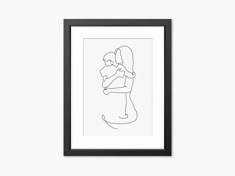 Black frame with a drawing of a mother and son silhouette. 