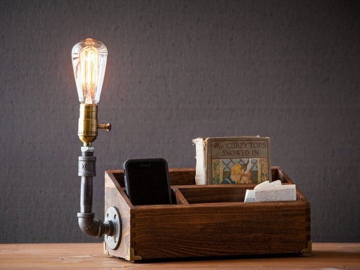 Wooden desk organizer with a light attached to the side.