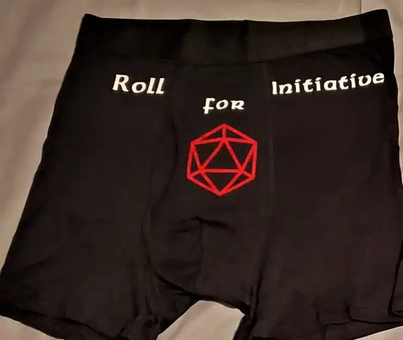 Black boxer shorts that says Roll for initiative. 