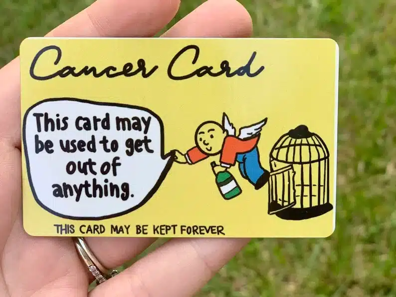 Yellow cancer card with a cartoon figurine on it that says This card may be used to get out of anything. 