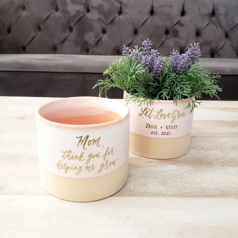 Mother's Day Gifts For First Time Grandmothers - Two personalized flower pots, one with a lavender plant in it. 