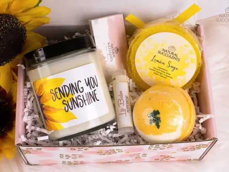 Box of sunshine: with candle, lip chap, soap, and bath bombs all white and yellow. 