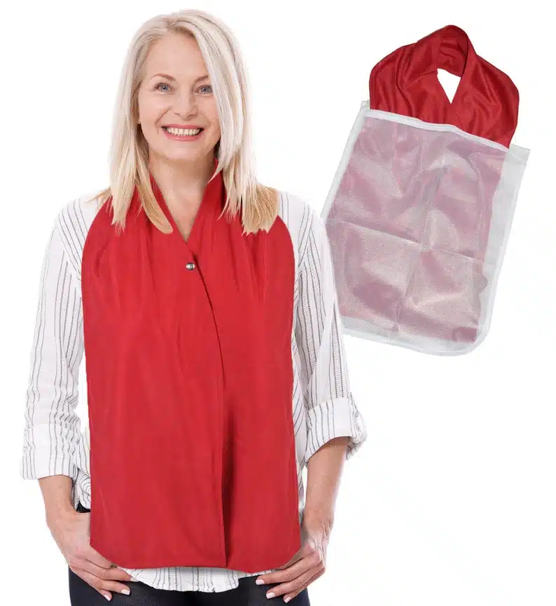 Woman wearing a red adult dining bib scarf. 
