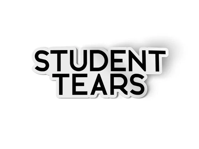 White sticker with black font that says "student tears" 