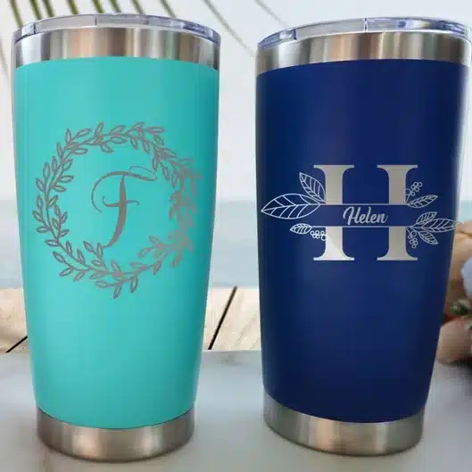 Administrative Professionals Day Gifts: Two travel tumblers shown, one teal and one navy blue both with silver personalized name and font. 