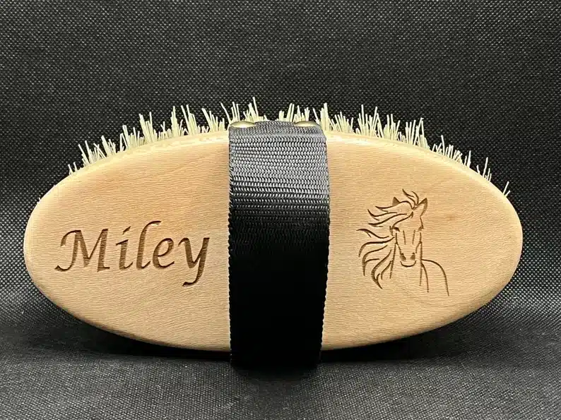 Tan personalized horse brush, this one says Miley with a horse on it. 