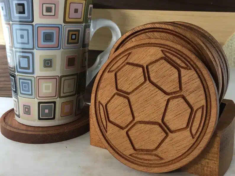 Four set of wooden soccer ball coasters. 