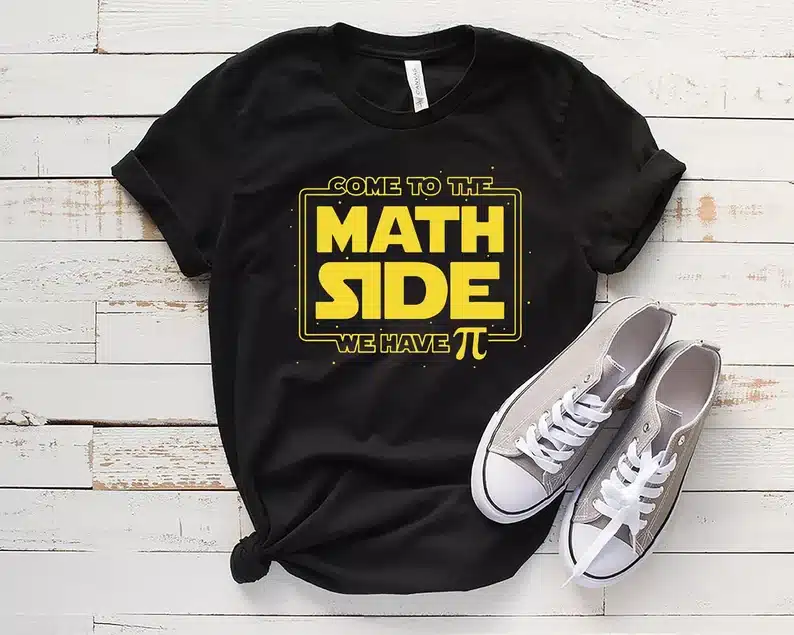 Black t-shirt with yellow font that says Come to the math side we have (pie symbol). 