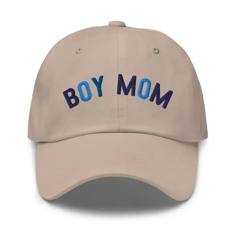 Tan baseball hat with blue font that says "boy mom" 