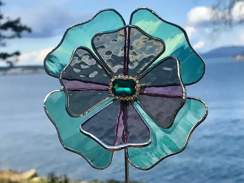 Blue and purple stained glass flower garden art. 