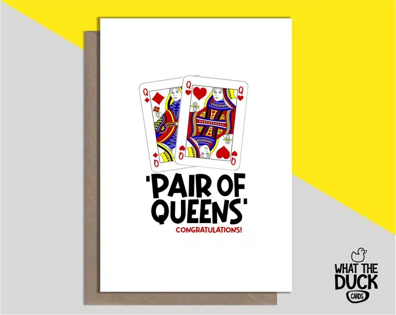 White card with two queen playing cards on it that says PAIR OF QUEENS congratulations. 