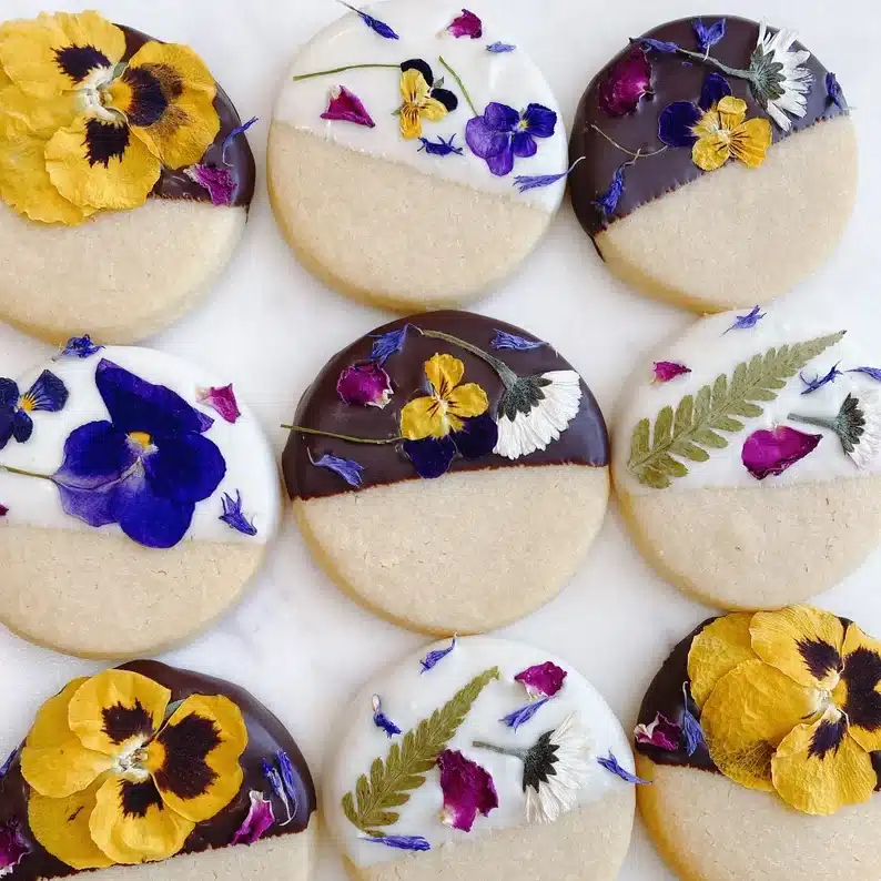 Pretty dipped shortbread cookies with edible flowers