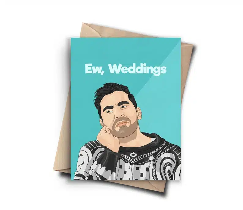 Light blue wedding card with cartoon version of David from Schitt's creek on it with white font that says 