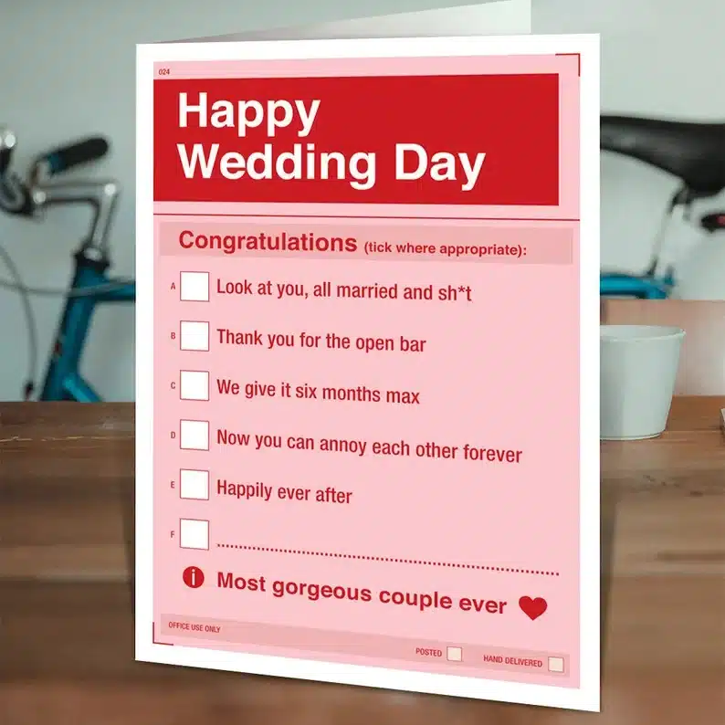 Pink and red wedding card that says Happy wedding day, congratulations and options to check off. 