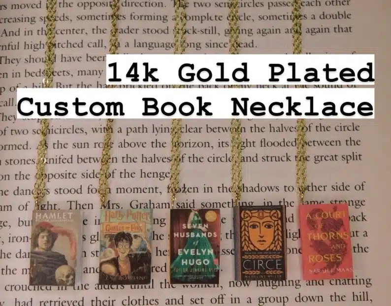 14k gold plaed custom book necklaces, showing five different ones. 