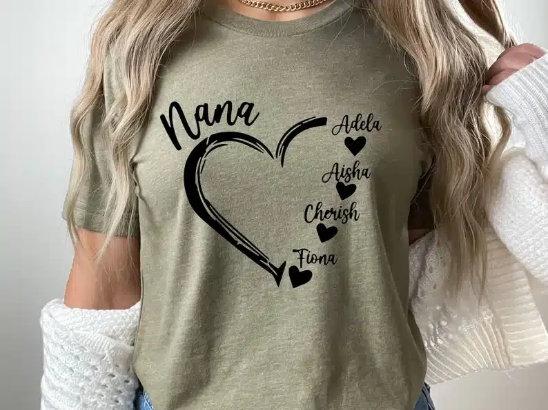 Sage green t-shirt with black font that says nana with a heart and all her grandchildren listed. 
