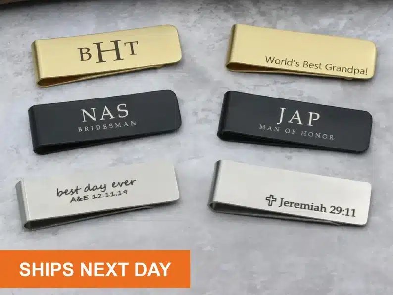 Six differnt personalized money clips, two gold, two black, and two silver. 