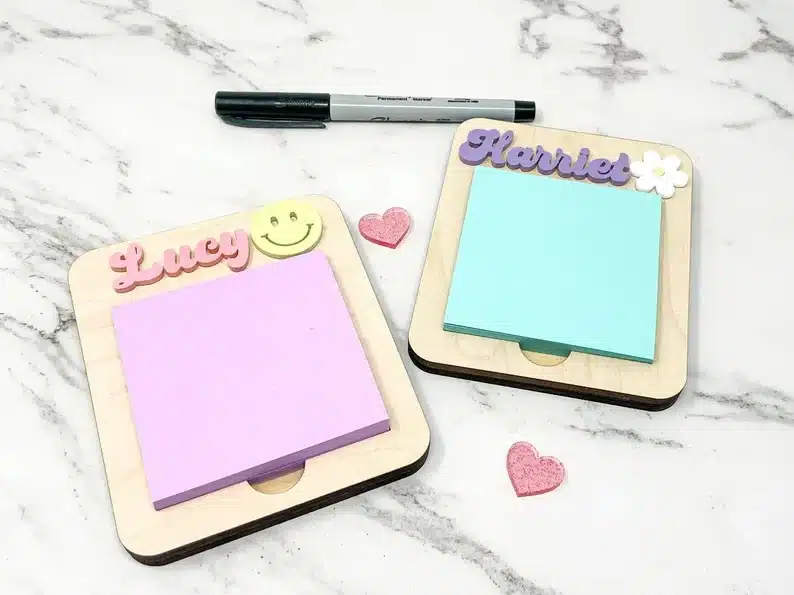 Personalized post it note holder, wooden base with a name above and post it notes on it. 