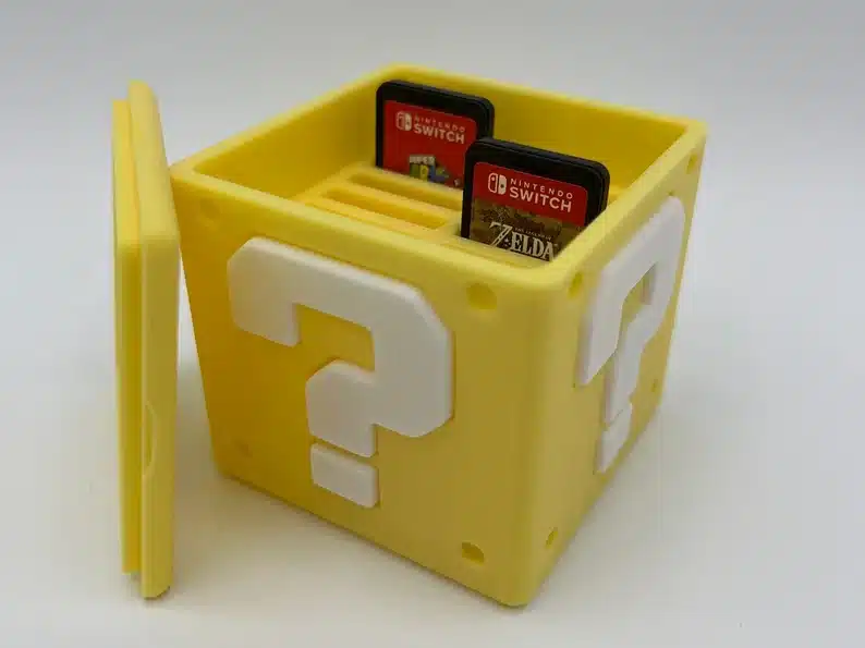 Yellow Nintendo block that holds Nintendo switch games. 