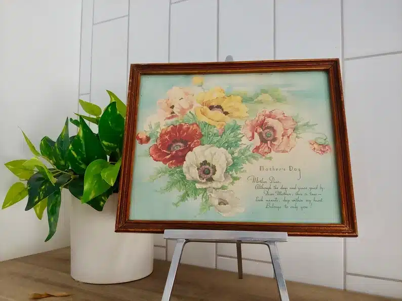 Wooden framed antique mothers day wall décor with red, white, yellow and pink flowers on it with a poem. 