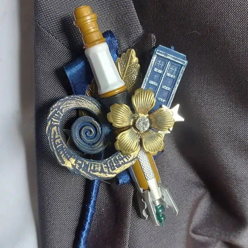 Geeky Boutonniere with light saber, blue phone booth, and more. 