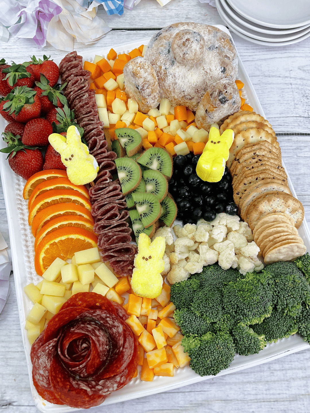 Bunny Butt Cheeseball & Charcuterie Board on a large white rectangle platter. 